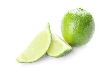 Green lime and slices on white background