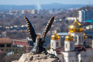 Eagle sculpture and church view