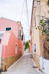 Fototapeta na wymiar Corfu island historical heritage, architecture, cosy streets, houses, buildings, doors, windows, vegetation, Greece, summer