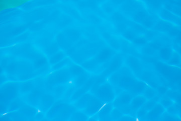 Blue water ripple reflection in the swimming pool