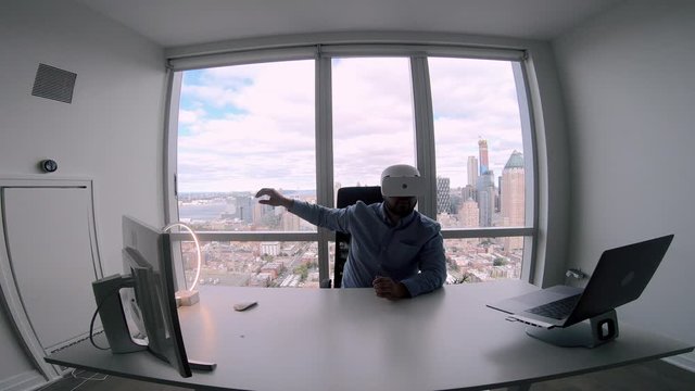 Millennial employee in VR headset creating BTL communications and direct sales for using in various businesses to demonstrate product at contemporary exhibitions, concept of visual simulation
