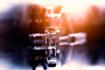 Vaccine tubes placed on the table along with other experimental equipment. To research vaccines to prevent disease