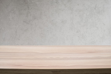 Scandinavian inspired wood table and concrete background