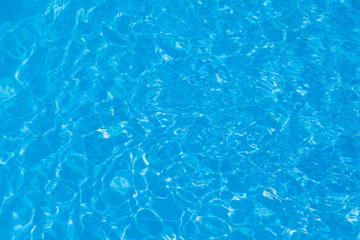 Blue water ripple reflection in the swimming pool