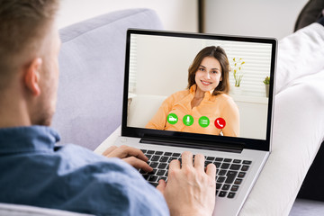 Man Video Chatting On Laptop