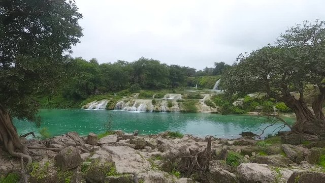 A surprising snapshot of the drone in the fall in Salalah, Ain Darbat, Sultanate of Oman