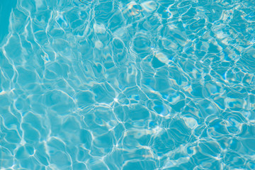 Blue water ripple reflection in the swimming pool