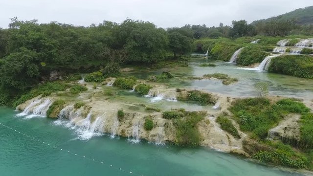 A surprising snapshot of the drone in the fall in Salalah, Ain Darbat, Sultanate of Oman