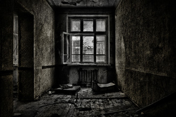 Fototapeta na wymiar Old abandoned room with a wooden window