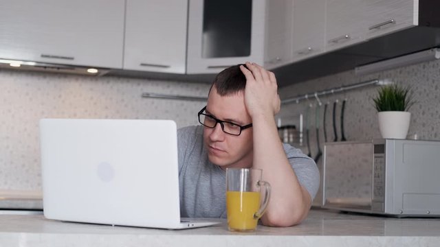 Young man has difficulty working remotely from home