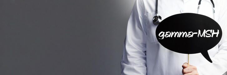 gamma-MSH. Doctor in smock holds up speech bubble. The word gamma-MSH is in the sign. Symbol of...