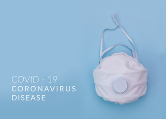 White medical mask on color background. A protection against pollution, virus, flu and coronavirus