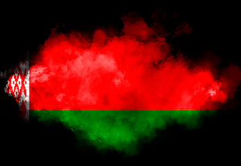 Belarusian flag performed from color smoke on the black background. Abstract symbol.