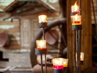 ฺBurning candles spreading aroma on candlestick. Zen and relax concept.