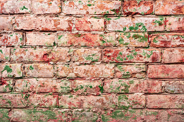Texture of a brick wall with cracks and scratches which can be used as a background