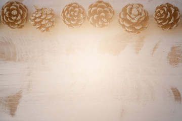 Dried pine balls on a white vintage wooden