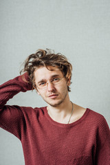 Young businessman holding head in his hands