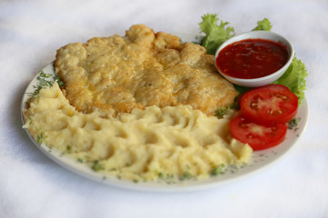 Pork chop with mashed potatoes, dishes of Russian national cuisine