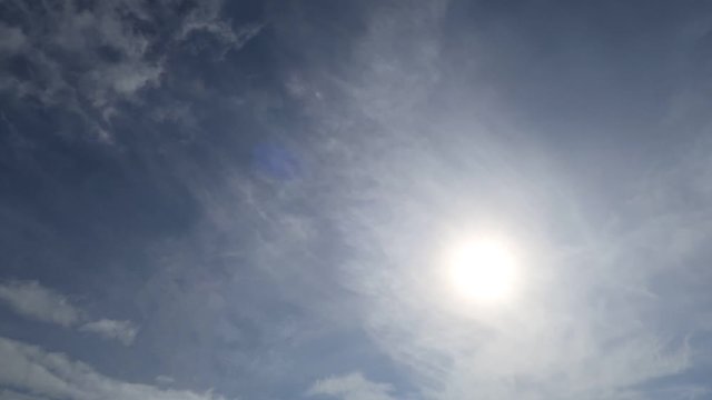 Sunrise in morning with pink sun rays move slowly in cloudy wispy sky background TimeLapse. Time Lapse video of moody gray cloud moving pass sunrise with sunlight. Sunrise break through massive clouds