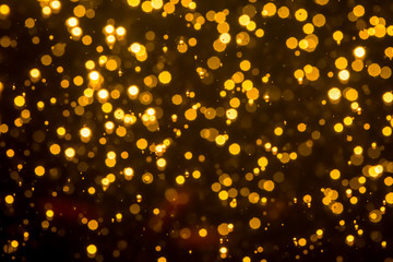 Fototapeta na wymiar Golden blur glitter lights abstract bokeh for Merry Christmas and New Year