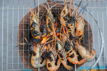 Fresh shrimp grilled bbq seafood on charcoal stove