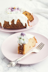 Glazed easter cake with flowers and candy