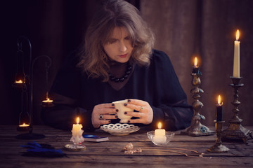 mature woman divines on coffee grounds