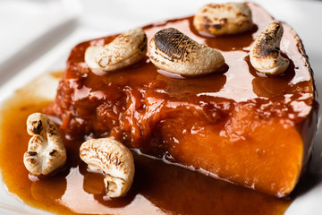 Traditional autumn pumpkin dishes. Roasted baked pumpkin with spices, olive oil. on a white plate. beautiful feed