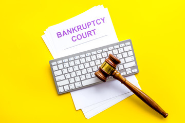 Bankruptcy court concept with gavel, document, keyboard on white background top-down