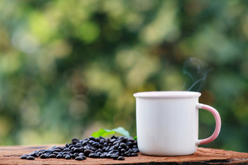 cup of coffee and bread on wood counter background and space for text
