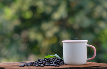 cup of coffee and bread on wood counter background and space for text