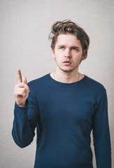 Fototapeta premium man shows the index finger up