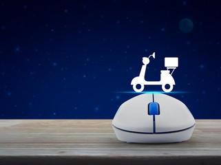 Motorcycle flat icon with wireless computer mouse on wooden table over fantasy night sky and moon, Business internet delivery service online concept
