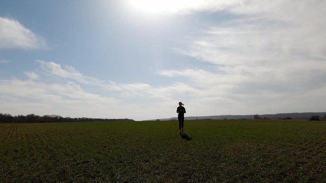 The girl is engaged in running in nature