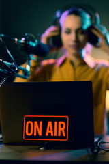 Young radio host getting ready for broadcasting