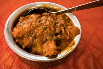 Close-up view of the chicken tikka masala in a bowl.