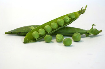 Fresh green pea pod with beans isolated on white background. Horizontal design element with clipping path