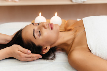 Obraz na płótnie Canvas Asian young woman enjoying scalp massage