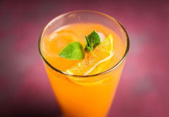 Fresh cocktail with vodka and orange juice on the rustic background. Selective focus. Shallow depth of field.