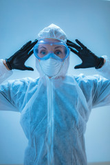 Medical doctor, scientist in full body suit for prevention from viruses and diseases.