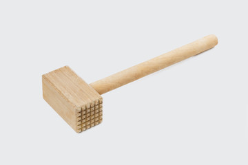 
Wooden hammer for beating meat. Mallet for cooking meat chops isolated on a white background.