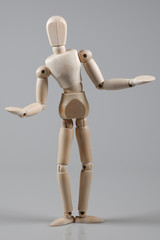 Wooden Mannequin on gray background