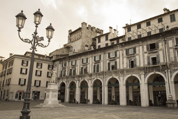 Fototapeta na wymiar Piazza della Loggia, Brescia, Lombardy, Italy. Aged photo effect.