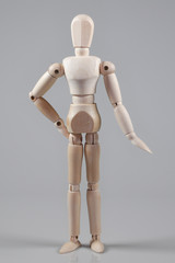 Wooden Mannequin on gray background