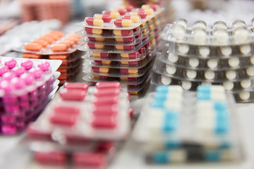 Obraz na płótnie Canvas Lots of medication on piles in pharmacy