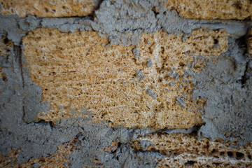 Dirty uneven brickwall texture background or backdrop with stains and cement smears