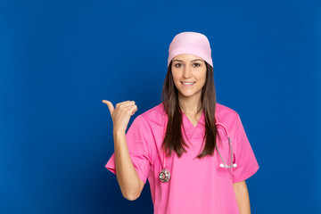 Young doctor with a pink uniform