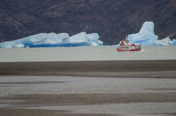 Tourist boat and icebergs on Grey Lake. Torres del Paine National Park. Magallanes and Chilean...