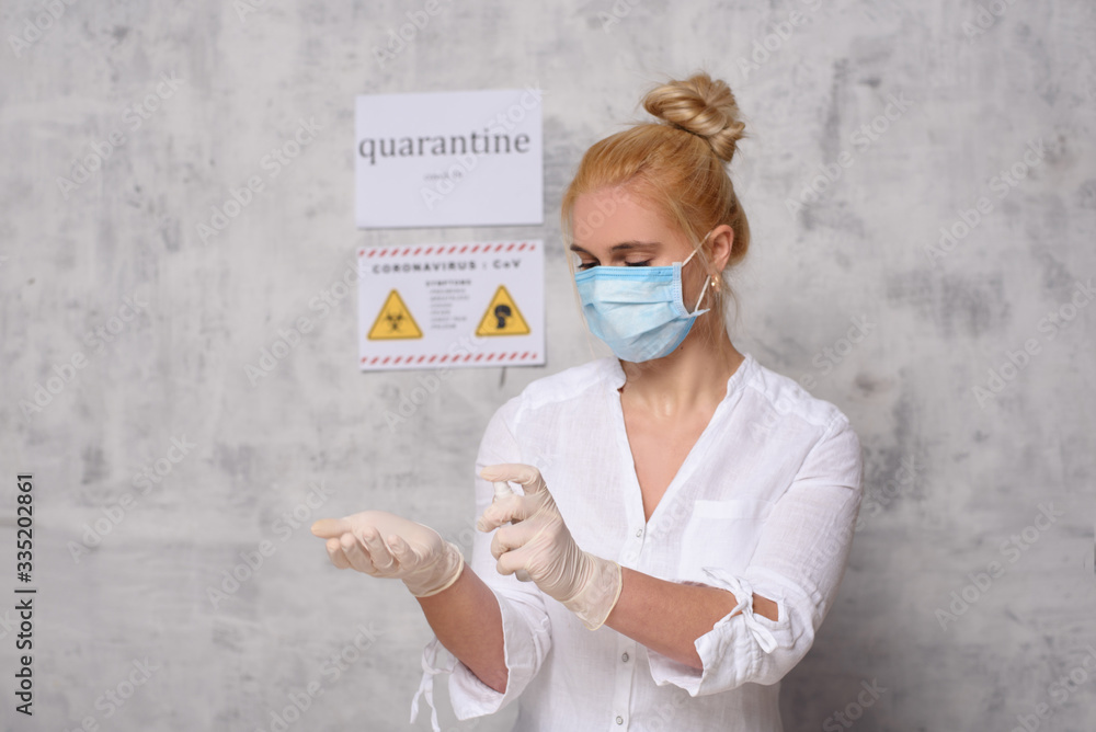 Wall mural Woman in quarantine for Coronavirus wearing protective mask and gloves.