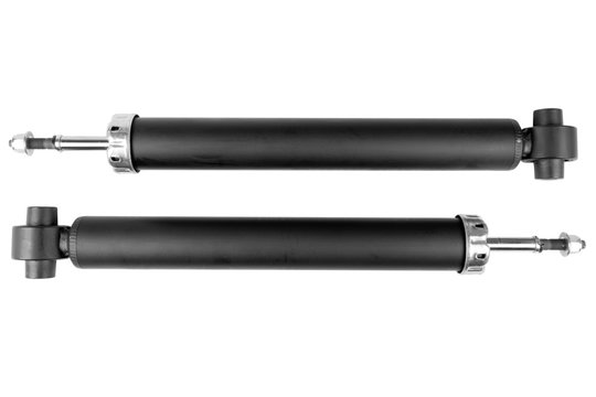 Pair car shock absorber isolated on white background. New auto shock absorber from a car on a white background with clipping path. Car spare parts